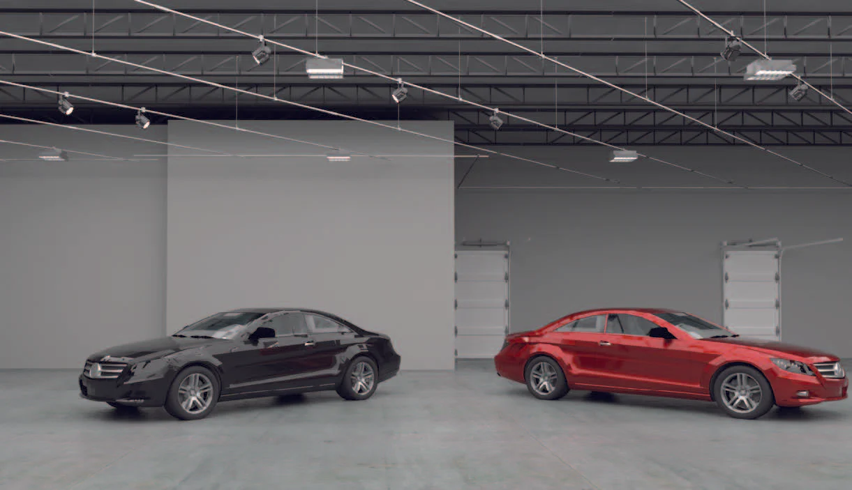 Track lighting system suspended over vehicles in automotive showroom for flexible illumination and display lighting