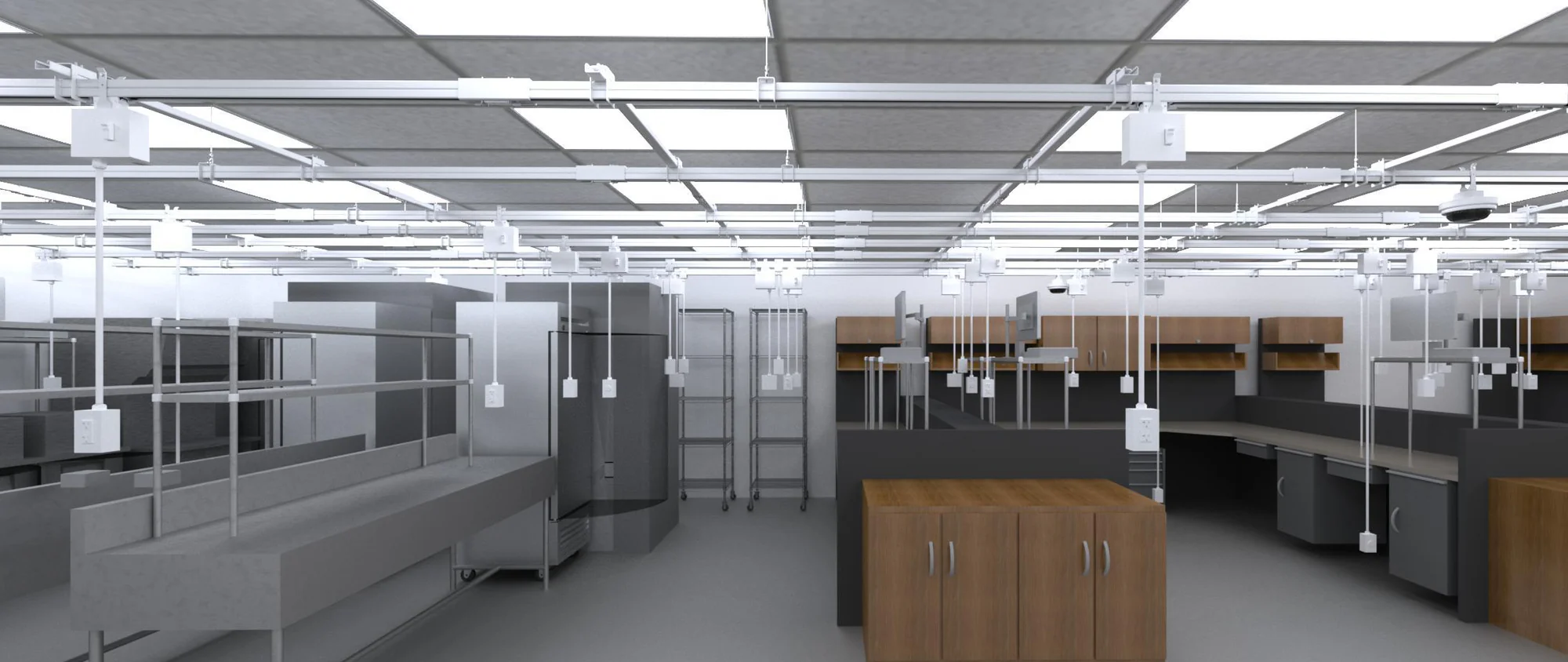 Suspended Track Busway system with plug-in power drops over lab workstations and cabinetry