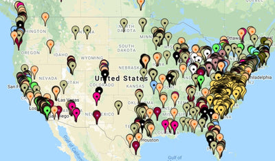 Map of the United States covered in multicoloured pins marking locations with USA TrackBusway.