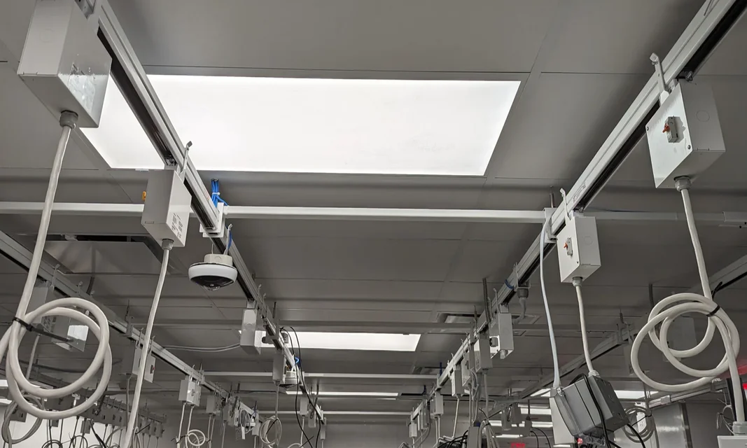 Ceiling installation with USA TrackBusway runs, PowerDrops, outlet boxes, cords, and plug-in devices