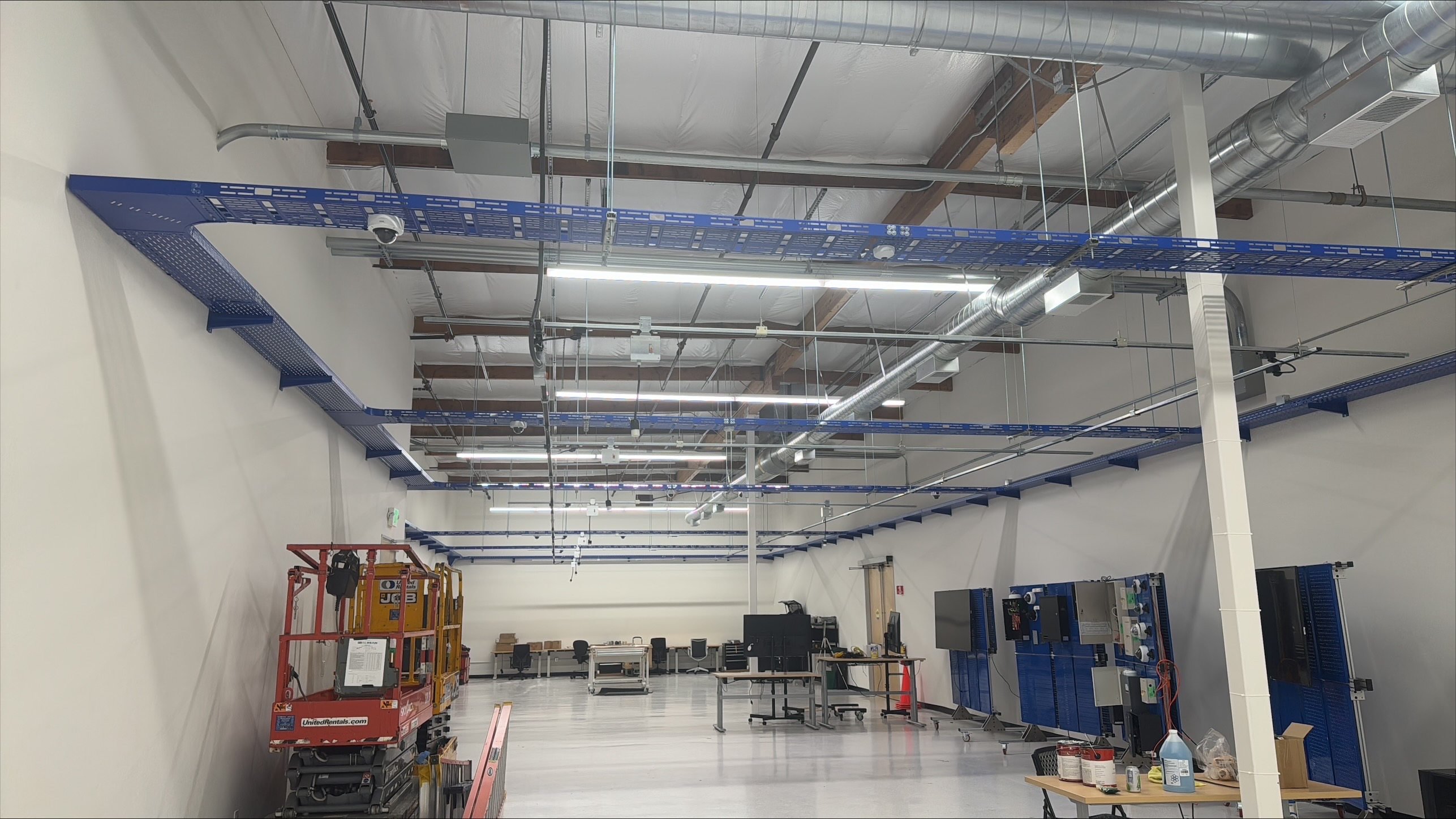 Track Busway installed overhead in a logistics warehouse to provide flexible power and lighting distribution