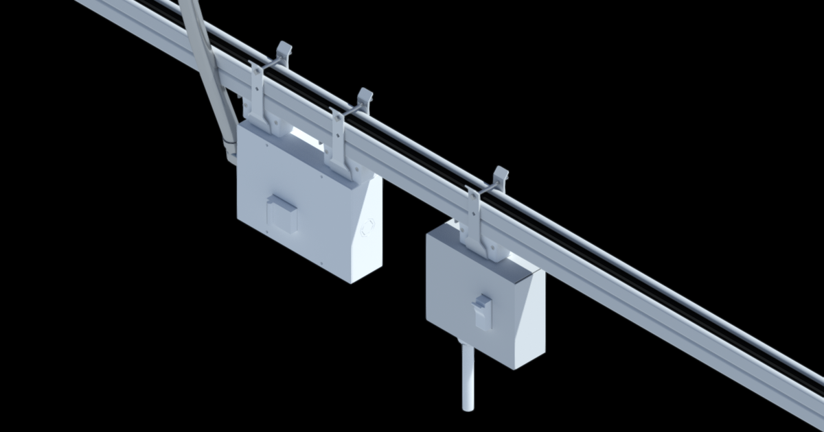 angled view of track busway with feed unit and power drop cord