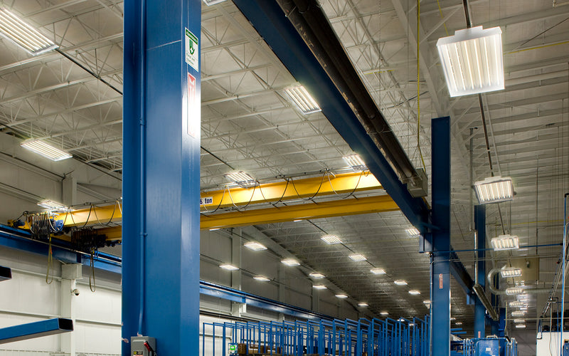 industria facility with high bay lights mounted on suspended track busway
