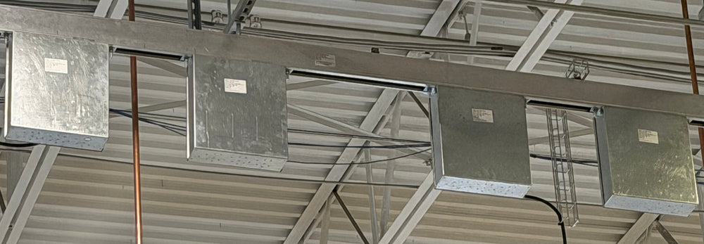 Rear view of tap-off enclosures installed along a 225A Track Busway run